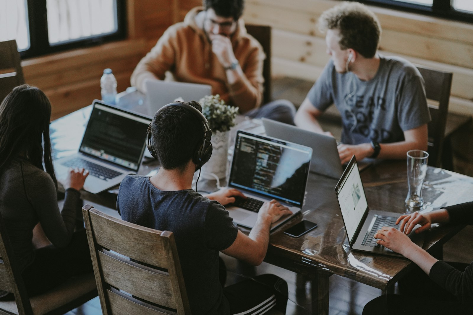 Team collaborating around a table in a modern workspace